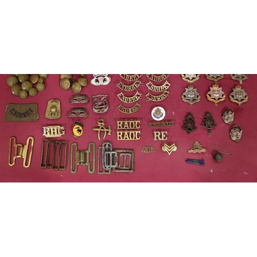 641 - A small quantity of various military cap badges, buttons, etc.