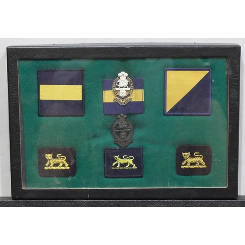 642 - Various East Surrey Military Regiment badges etc. all in single frame and another framed set (2)