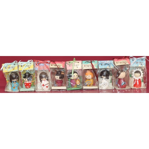 644 - 9 Japanese Momiji dolls in original plastic cases