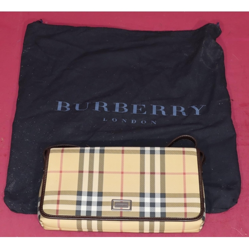 645 - A Burberry classic clutch bag, 29cm wide, with outer cover (bag in good condition)