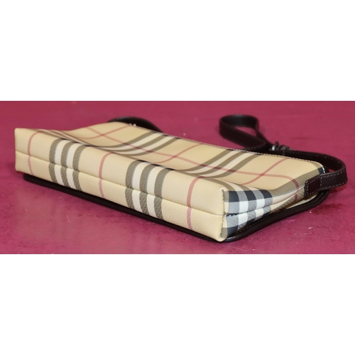 645 - A Burberry classic clutch bag, 29cm wide, with outer cover (bag in good condition)