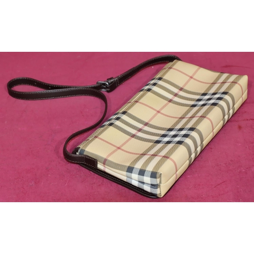 645 - A Burberry classic clutch bag, 29cm wide, with outer cover (bag in good condition)