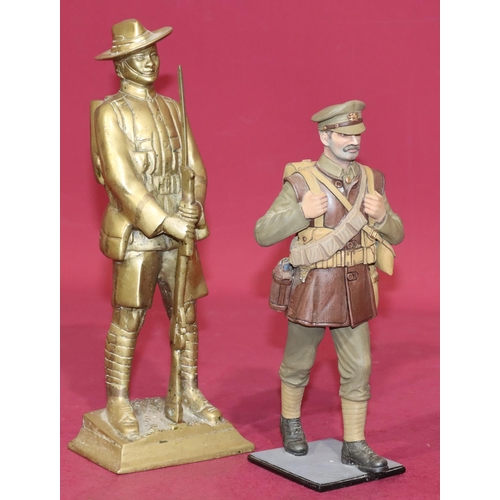 646 - A heavy painted metal figure of a military gentleman walking, on square base, 25.5cm high, a brass f... 