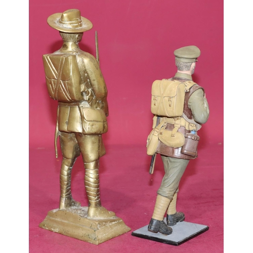 646 - A heavy painted metal figure of a military gentleman walking, on square base, 25.5cm high, a brass f... 