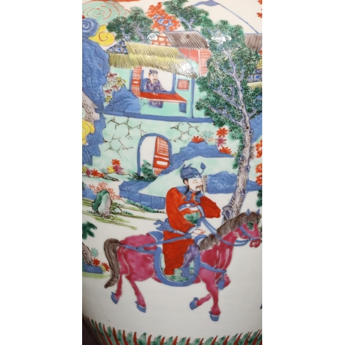 66 - A Chinese large round bulbous thin necked vase on white ground with multi-coloured landscape decorat... 