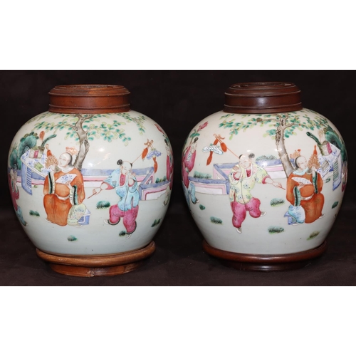 67 - A pair of 19th Century Chinese round bulbous shaped ginger jars with wooden covers and stands on whi... 