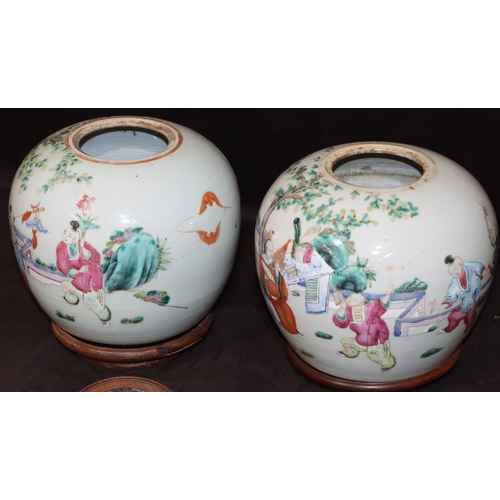 67 - A pair of 19th Century Chinese round bulbous shaped ginger jars with wooden covers and stands on whi... 