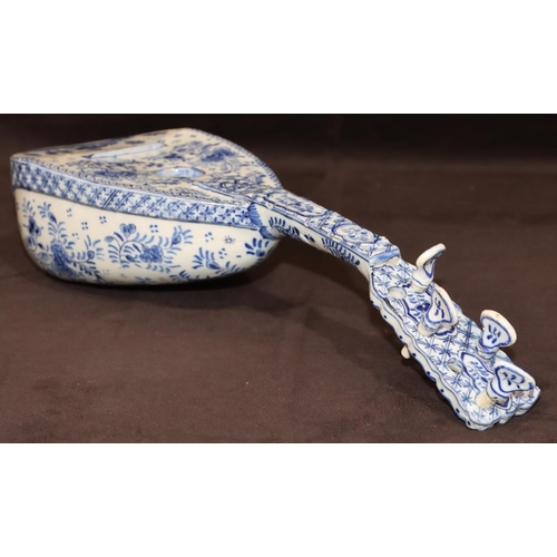 68 - A French Faience Delft style model of a mandolin on blue and white ground with building, floral, lea... 