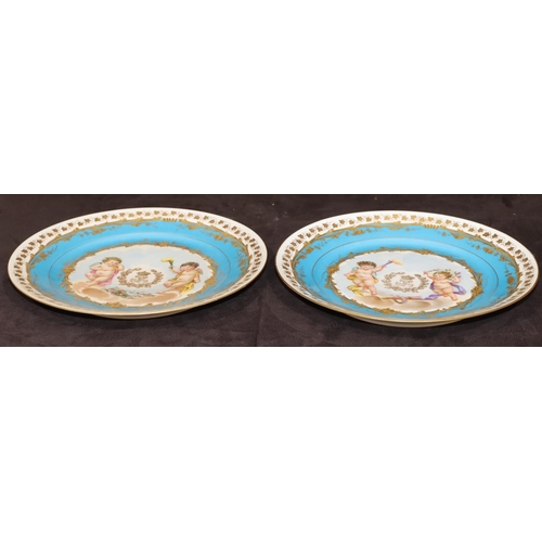 72 - A pair of 19th Century Sevres round plates on turquoise and white ground with multi-coloured cupid, ... 