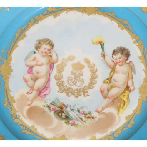 72 - A pair of 19th Century Sevres round plates on turquoise and white ground with multi-coloured cupid, ... 