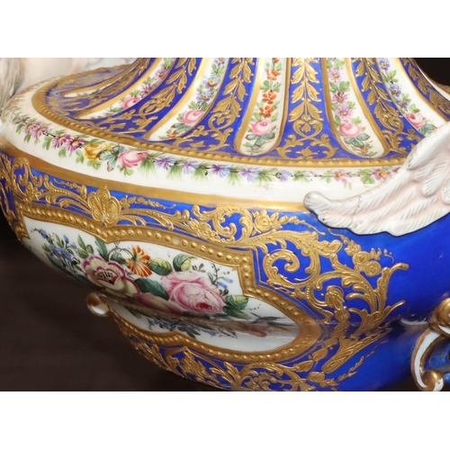 73 - A Sevres large oval bulbous thin necked vase with 2 raised winged angels on white and blue ground wi... 