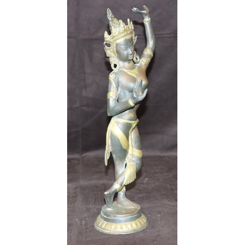 731 - A bronze and gilt figure of an Eastern dancer on round base, 42cm high