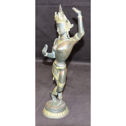 731 - A bronze and gilt figure of an Eastern dancer on round base, 42cm high