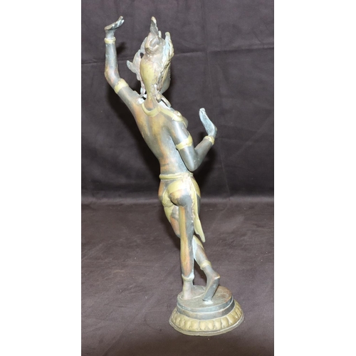 731 - A bronze and gilt figure of an Eastern dancer on round base, 42cm high