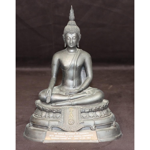 732 - An Eastern bronze figure of a seated Buddhist monk with inscription to front and reverse, 25.5cm hig... 