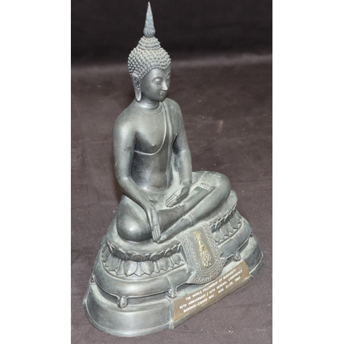 732 - An Eastern bronze figure of a seated Buddhist monk with inscription to front and reverse, 25.5cm hig... 