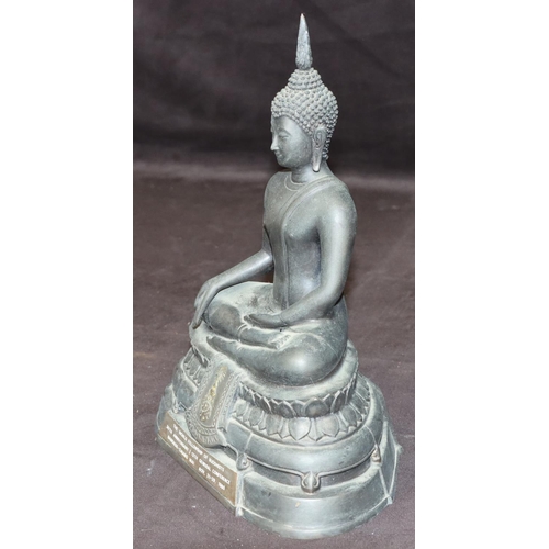 732 - An Eastern bronze figure of a seated Buddhist monk with inscription to front and reverse, 25.5cm hig... 