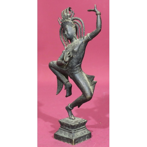 736 - An Eastern bronze figure of a lady dancer on square platform base, 32cm high