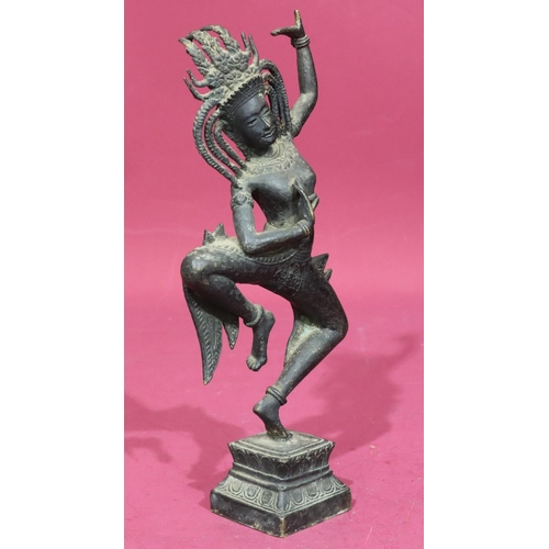 736 - An Eastern bronze figure of a lady dancer on square platform base, 32cm high