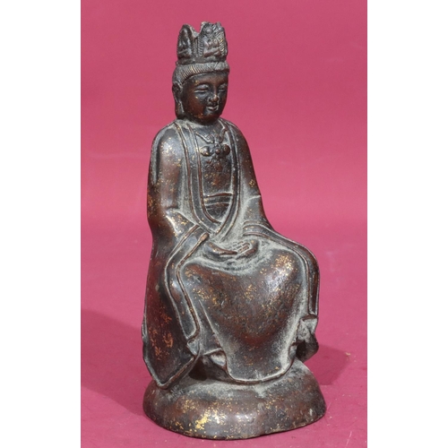 738 - An Oriental bronze figure of a seated Buddha with allover gilt fleck decoration, stamp to back of ba... 