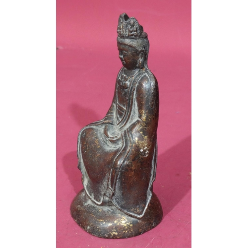 738 - An Oriental bronze figure of a seated Buddha with allover gilt fleck decoration, stamp to back of ba... 