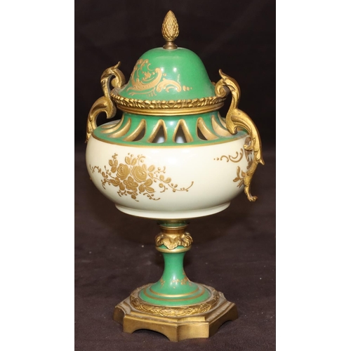 74 - A Sevres porcelain and ormolu round bulbous thin necked lidded potpourri on white and green ground w... 