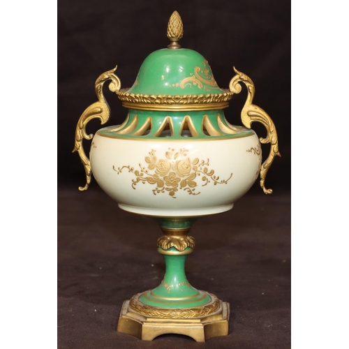 74 - A Sevres porcelain and ormolu round bulbous thin necked lidded potpourri on white and green ground w... 