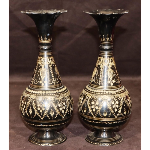 742 - A pair of metal round bulbous thin necked trumpet shaped vases on black ground with gilt, swag, flor... 