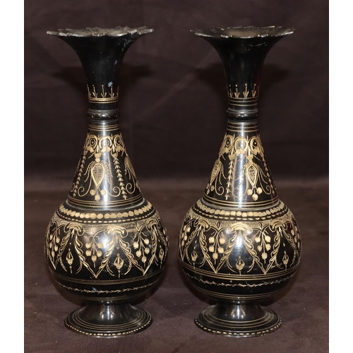 742 - A pair of metal round bulbous thin necked trumpet shaped vases on black ground with gilt, swag, flor... 