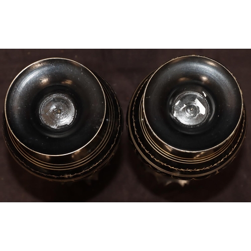 742 - A pair of metal round bulbous thin necked trumpet shaped vases on black ground with gilt, swag, flor... 