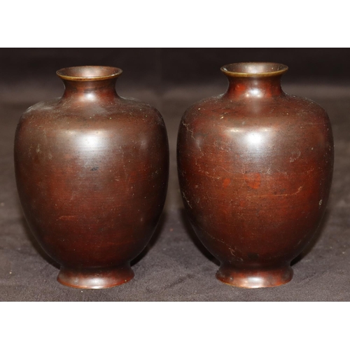 743 - A pair of bronze small round bulbous thin necked vases, 12cm high