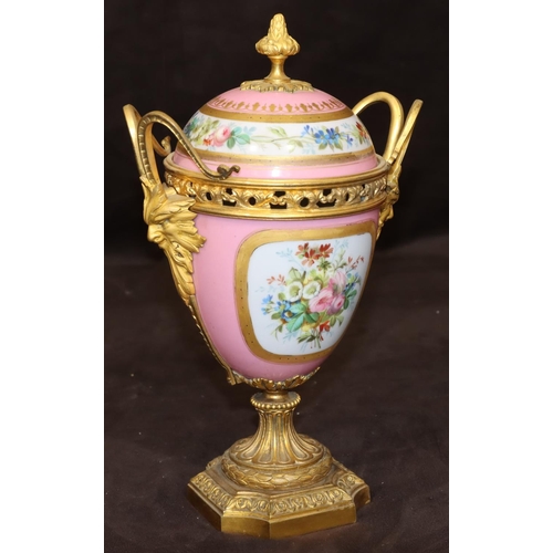 75 - A 19th Century Sevres style porcelain and ormolu lidded vase on pink ground with multi-coloured cupi... 