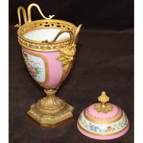 75 - A 19th Century Sevres style porcelain and ormolu lidded vase on pink ground with multi-coloured cupi... 