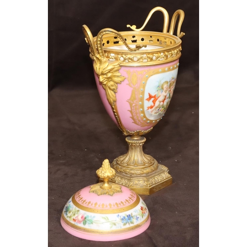 75 - A 19th Century Sevres style porcelain and ormolu lidded vase on pink ground with multi-coloured cupi... 