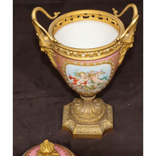 75 - A 19th Century Sevres style porcelain and ormolu lidded vase on pink ground with multi-coloured cupi... 