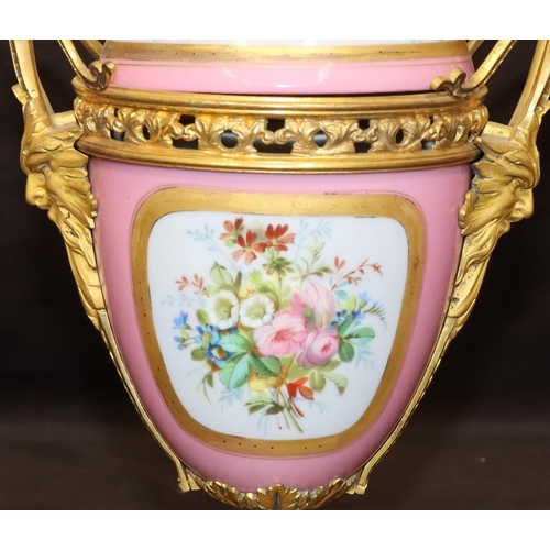 75 - A 19th Century Sevres style porcelain and ormolu lidded vase on pink ground with multi-coloured cupi... 