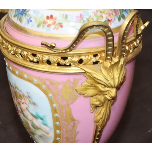 75 - A 19th Century Sevres style porcelain and ormolu lidded vase on pink ground with multi-coloured cupi... 