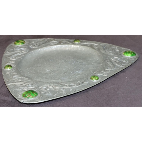 755 - An Arts Nouveau triangular hammered pewter dish with raised green carbuncles and bird motifs, 32cm w... 