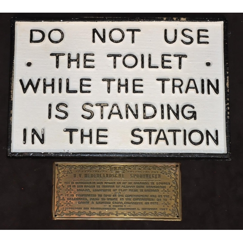 770 - A cast iron railway sign, 29cm wide and a small brass Continental sign, 16.5cm wide (2)