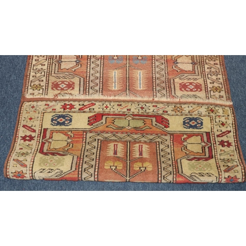 771 - A Persian style rug with multi-coloured decoration, centre medallion, 140cm x 88cm