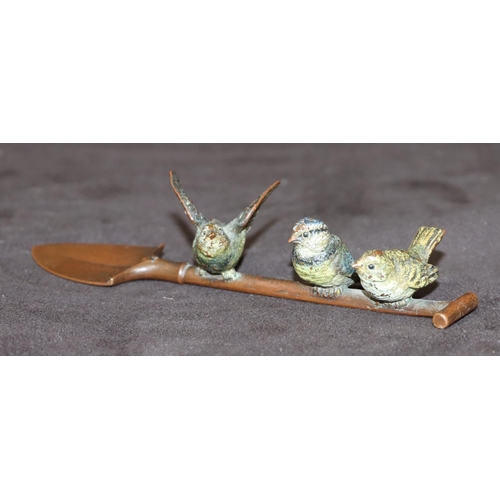 775 - A Viennese cold painted bronze group of 3 birds perched on a shovel, 14cm long