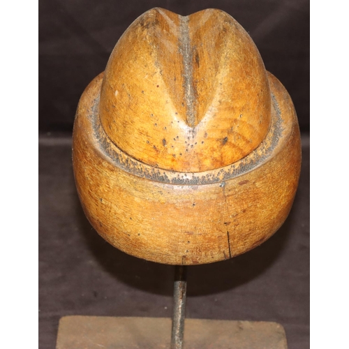 778 - A wooden and iron tabletop hat maker's mould, 32cm high