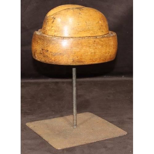 778 - A wooden and iron tabletop hat maker's mould, 32cm high