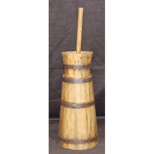 779 - A wooden circular butter churn with metal mounts, 68cm high overall