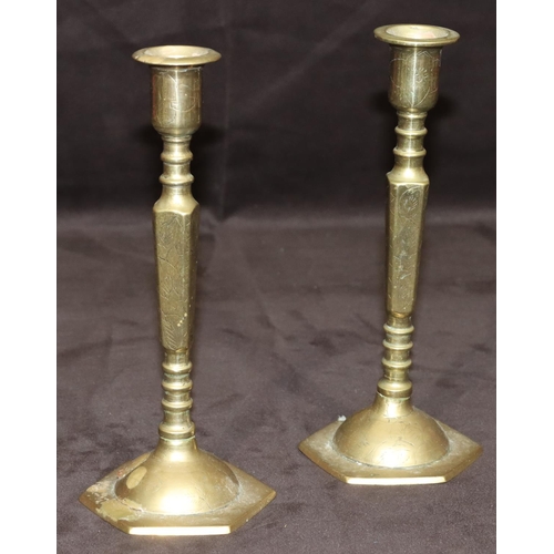 780 - A pair of Oriental small brass candlesticks on square turned stem with hexagonal bases, 20cm high