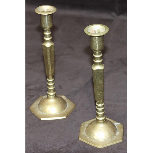 780 - A pair of Oriental small brass candlesticks on square turned stem with hexagonal bases, 20cm high