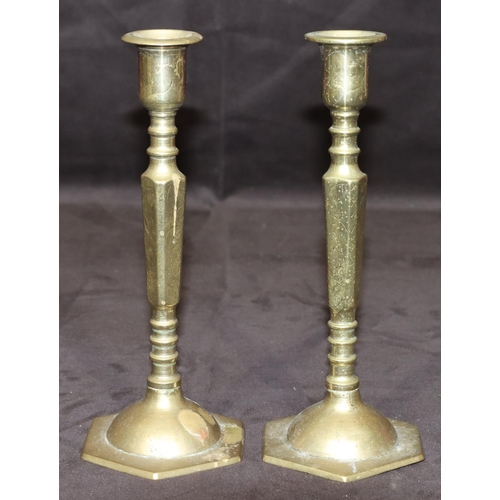 780 - A pair of Oriental small brass candlesticks on square turned stem with hexagonal bases, 20cm high