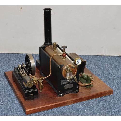 790 - A Stuart stationary live model steam engine mounted on mahogany base, 37cm x 34cm