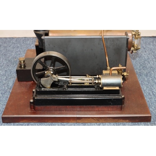 790 - A Stuart stationary live model steam engine mounted on mahogany base, 37cm x 34cm