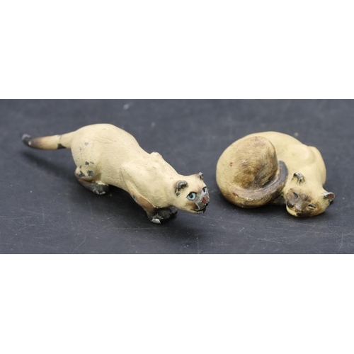 798 - 2 small painted bronze figures of cats, largest 7cm long. (2)